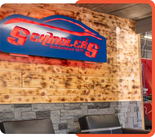 Reception area of Schindler's Garage with a customer service desk and waiting area.