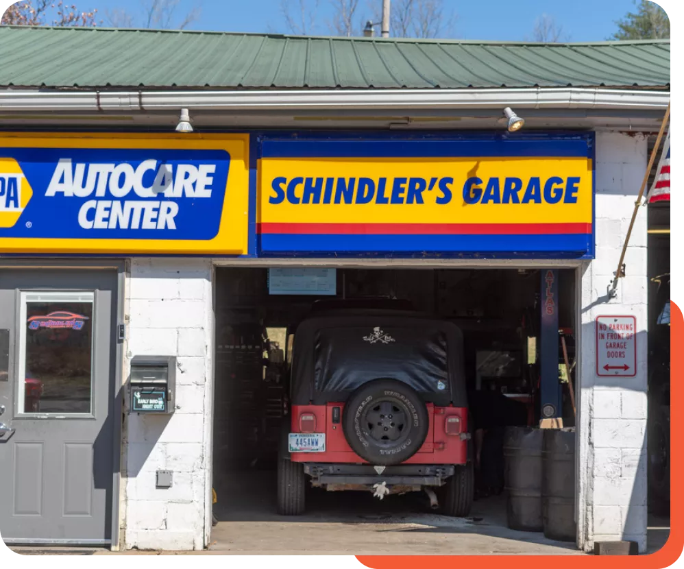 An image of Schindler's Garage exterior showing signage and service bays.