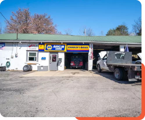 Exterior view of Schindler's Garage with spacious parking area at Schindler's Garage for customers.