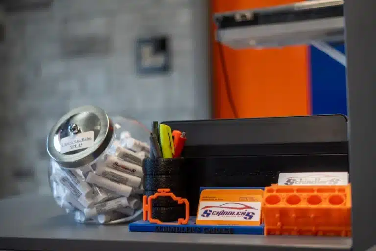 Close-up view of the reception desk at Schindler's Garage, showcasing a neat and organized workspace for customer service.