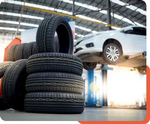 Display of various tires, including new replacements and spare tires, at Schindler's Garage, ready for installation and service.