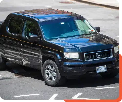 a black truck parked on a street