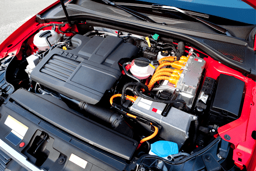 Diagnostics for hybrid and electric vehicle maintenance and repair in Flyods Knobs, IN. with Schindler’s Garage. Image of new Hybrid car engine on red car.