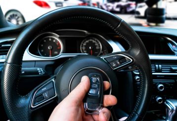 Close-up of a key fob being programmed with the vehicle's electronic system.